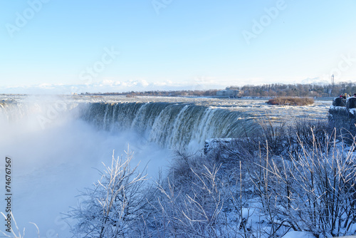 Niagara waterfalls in Canada. The mighty falls is flowing hard when being frozen. The Canada ends has greater looks where the start at its horseshoe. This natural wonder is beautiful in all seasons