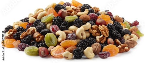 A pile of mixed nuts and raisins arranged on a white background. The image showcases a combination of various nuts and raisins, providing a delightful and crunchy snack option. The nuts appear to be © 2rogan