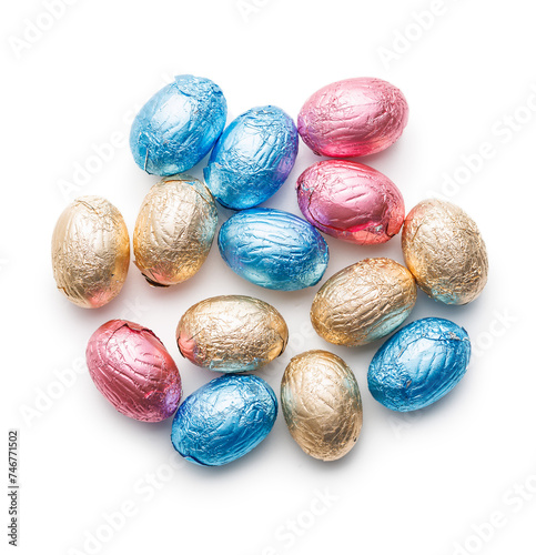 Easter chocolate eggs wrapped in aluminium foil isolated on white background.