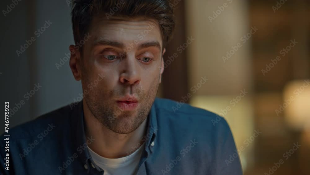 Worried freelancer talking online late at home closeup. Nervous man video call Worried freelancer talking online late at home closeup. Nervous man video call