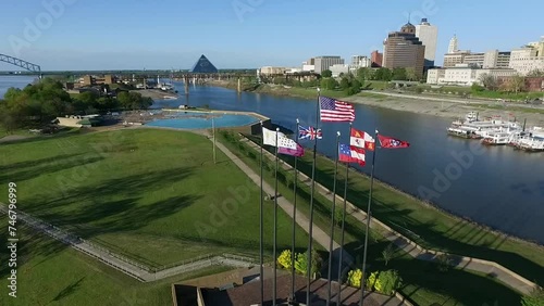 Waving Flags in Mud Island River Park, Memphis, Tennessee. Hernando de Soto Bridge and Mississippi River in Background. Drone photo