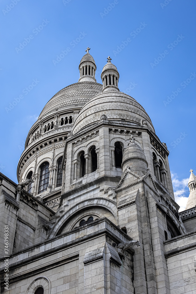 Paris Basilica Sacre Coeur at top of Montmartre - Roman Catholic Church and minor basilica, dedicated to Sacred Heart of Jesus. Paris, France.