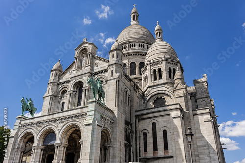 Paris Basilica Sacre Coeur at top of Montmartre - Roman Catholic Church and minor basilica, dedicated to Sacred Heart of Jesus. Paris, France.