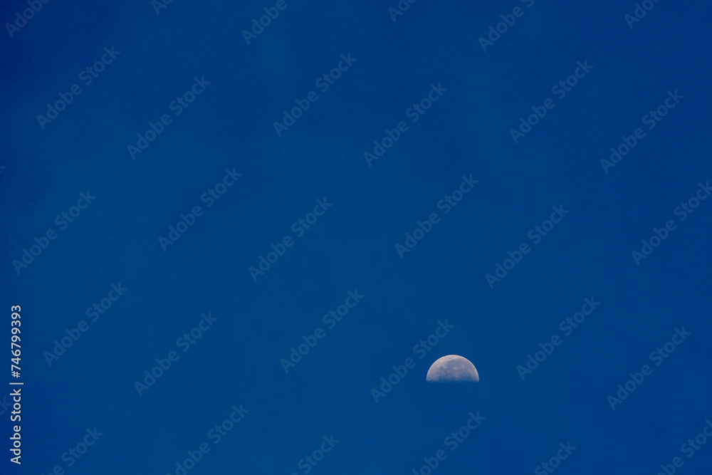 blue sky and half moon blue sky and half moon