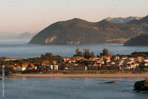 Panoramic view of the beautiful village of Noja since an observation point at sunset in a sunny day, Cantabria, Spain.