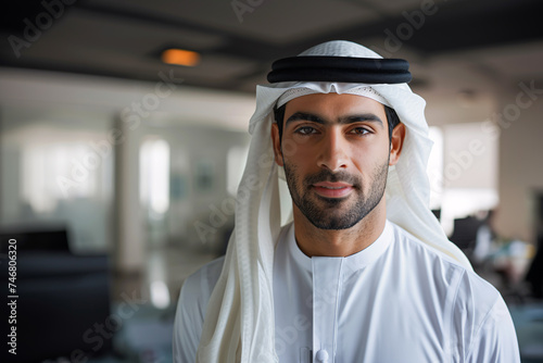 Arab businessman dressed in traditional clothes, in an office.