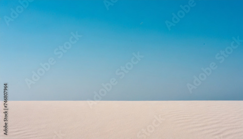 Clear blue sky with white sand dune. Desert horizon landscape. Background with space for text