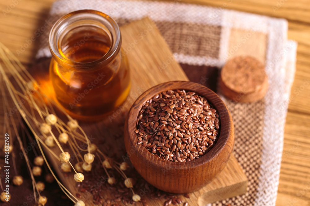 Brown linen seeds, flaxseed vegetable oil on rustic wooden background. Healthy super food Brown linen seeds, flaxseed vegetable oil on rustic wooden background. Healthy super food