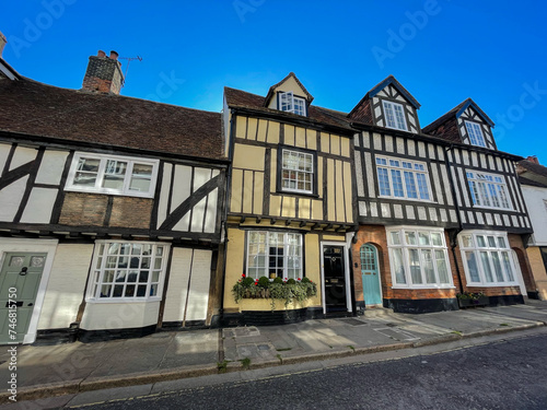 Tudor style houses with black and white timber frame on a quaint English street