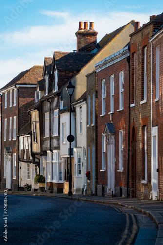 Quiet English street with charming townhouses in variety of architectural styles photo