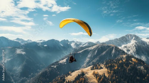 Paraglider flying over the mountains.