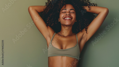 A candid and unaltered cropped photograph capturing the happiness of a girl as she shows off her healthy and toned tummy, achieved through mindful eating and exercise. Generative AI