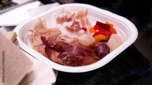Gourmet Cured Meat and Pickled Vegetables on a Serving Plate