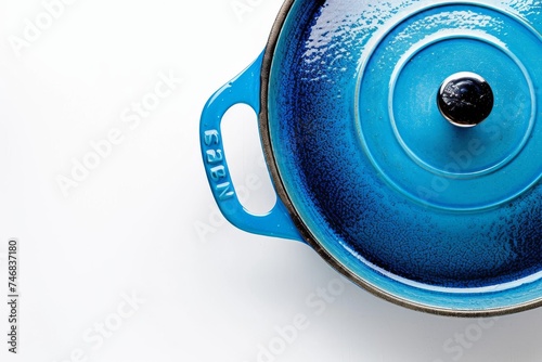 Blue cast iron Dutch oven with enamel coating displayed on white