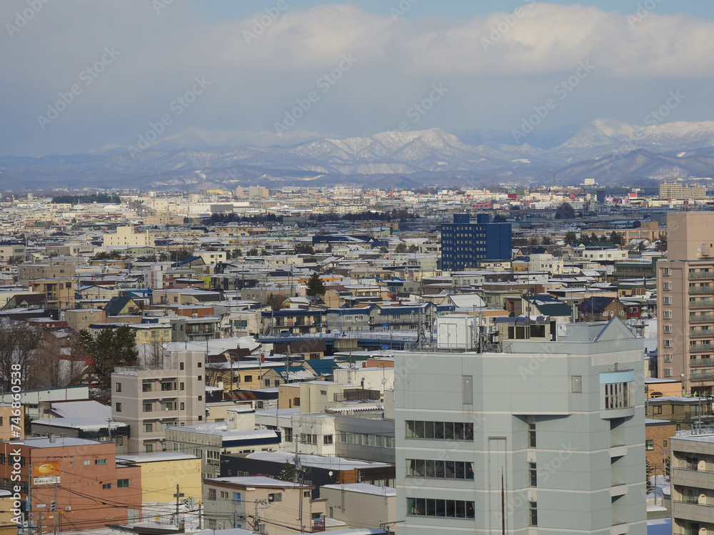 ハイアングルで見た朝の冬の旭川市の街並みの風景 ハイアングルで見た朝の冬の旭川市の街並みの風景