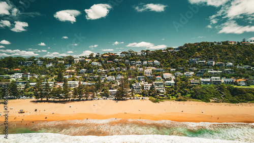 Fototapeta Naklejka Na Ścianę i Meble -  Stunning ocean view of the waves and beach in the Northern Beaches of NSW, Sydney, Australia. The view was captured from above using a drone.