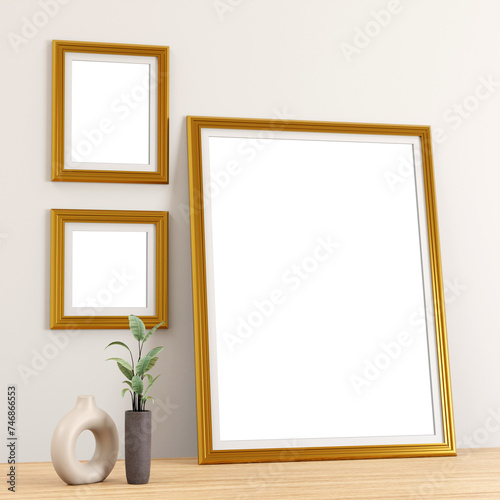 two golden frame on the wall and a large portrait photo frame
