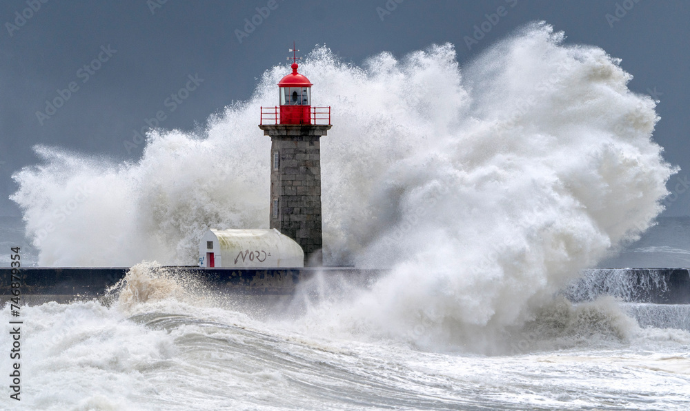 Lighthouse and oceanic wave during storm