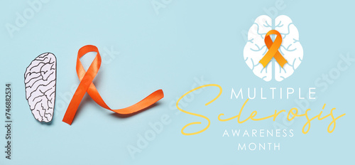Awareness banner for Multiple Sclerosis Awareness Month with paper brain and orange ribbon photo