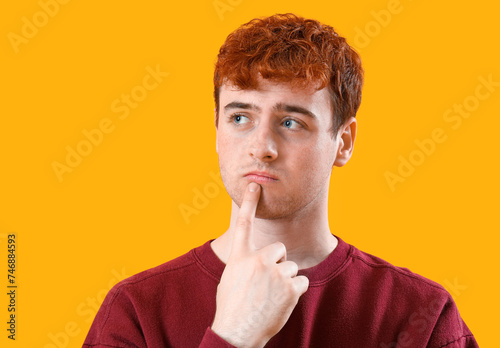 Thoughtful young man with r...