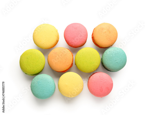 Different tasty sweet macaroons on white background
