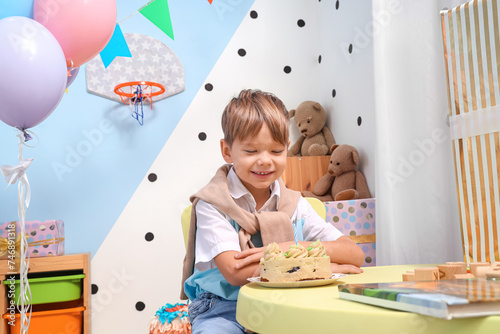 Little boy with cake celebr...