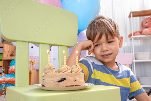 Cute little boy with cake c...