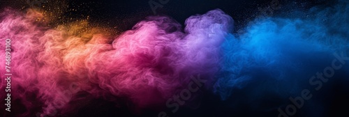 Colorful smoke clouds on black.
