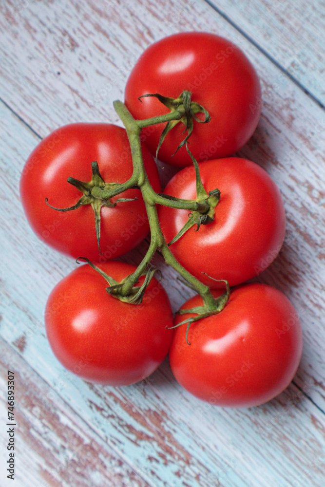 Red tomatoes on the vine Red tomatoes on the vine