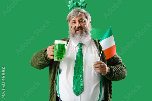 Mature man with beer and Ir...