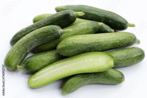 Mini cucumbers on white background.