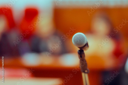 Microphone in front of an Audience at a Press Conference Event. Press Conference Microphone in a Meeting Room 