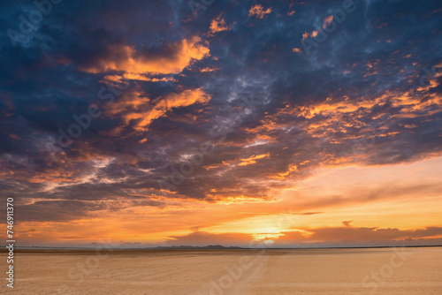 sunset with beautiful orange sky in the carrizales desert. Guajira, Colombia. photo