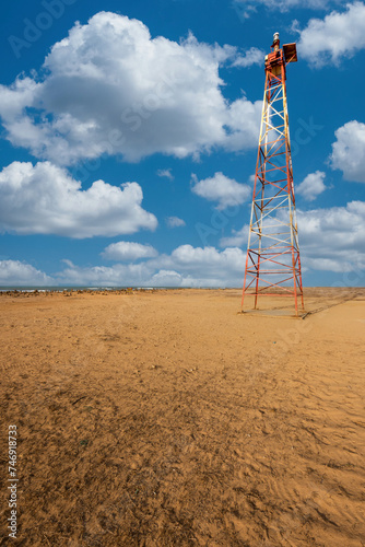 Punta Gallinas lighthouse and blue sky with clouds. Guajira, Colombia.