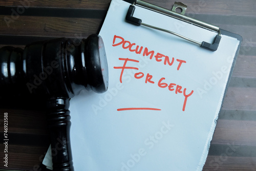 Картината върху платно Concept of Document Forgery write on paperwork isolated on wooden background