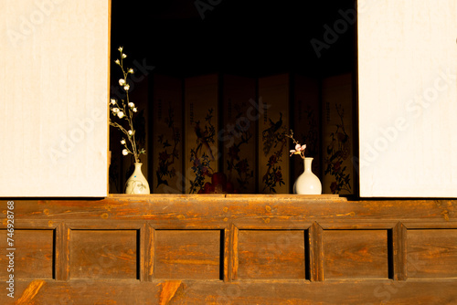 Flowers in window of traditional Korean Hanok house