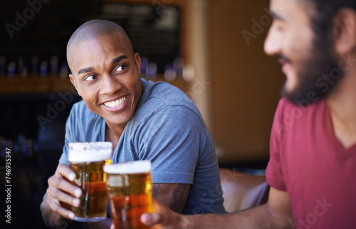 Friends  man and happiness in pub with beer for happy hour  relax or social event with cheers. Diversity  people and drinking alcohol in restaurant or club with smile for bonding and celebration