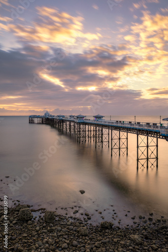 Sunrise golden light over Llandudno Pier in the Victorian seaside resort in North Wales  United Kingdom