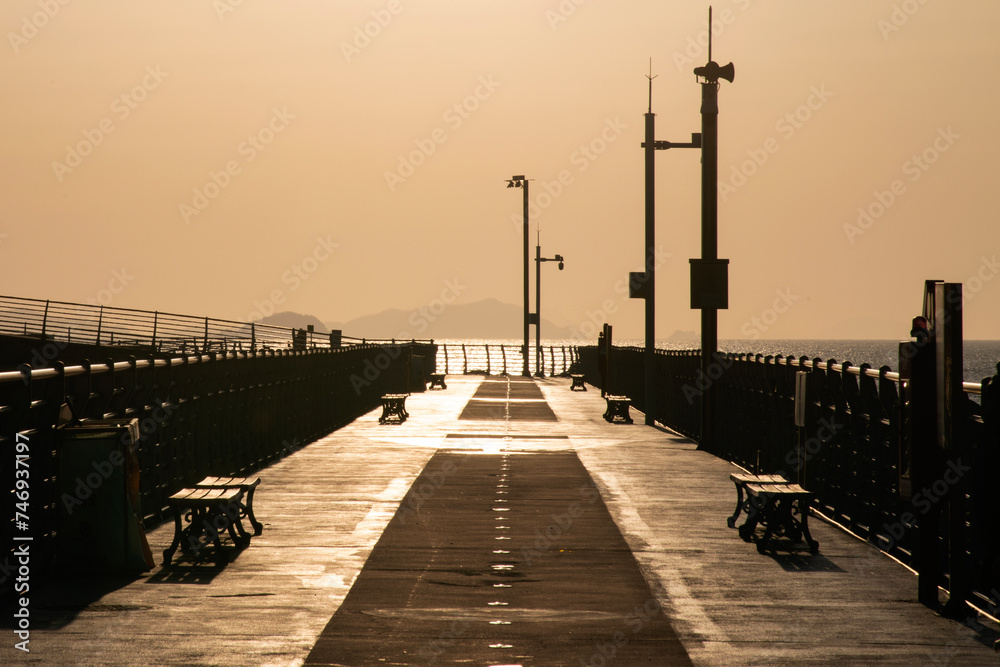 Footpath on the seawall during the sunset