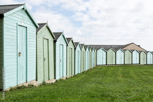 Blue and green beach huts