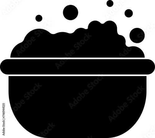 Black washbowl with foam and bubbles.