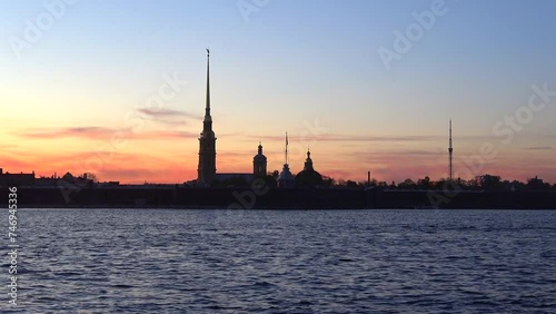 The silhouette of the Peter and Paul Cathedral against the background of the May sunset. Peter and Paul Fortress, Saint Petersburg photo