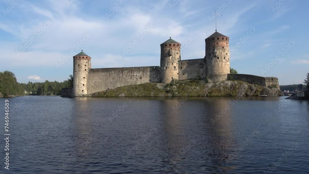 View of the ancient fortress of Olavinlinna on a sunny July day. Savonlinna, Finland View of the ancient fortress of Olavinlinna on a sunny July day. Savonlinna, Finland