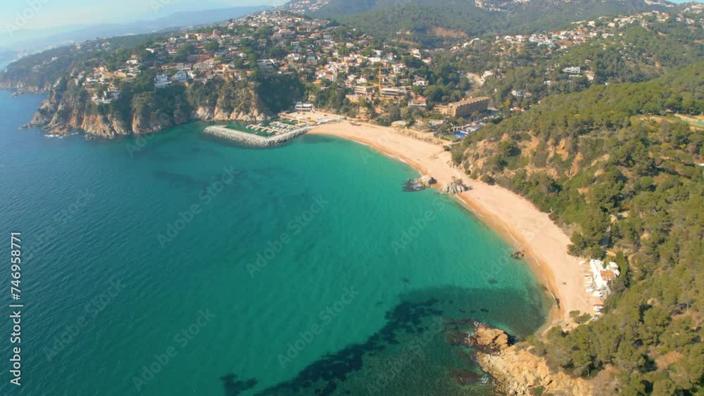 Mesmerizing aerial views of Lloret De Mar and the secluded paradise of Cala Canyelles, nestled amidst the rugged beauty of Costa Brava. Mesmerizing aerial views of Lloret De Mar and the secluded paradise of Cala Canyelles, nestled amidst the rugged beauty of Costa Brava.