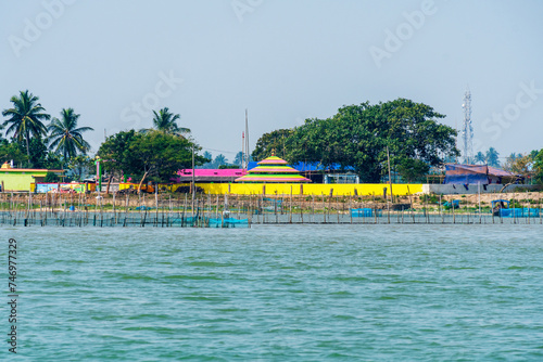 Landscape of Fishermen village on the bank of Chilika lake, India photo