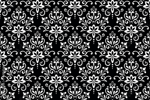 Wallpaper in the style of Baroque. Seamless vector background. White and black floral ornament. Graphic pattern for fabric, wallpaper, packaging. Ornate Damask flower ornament
