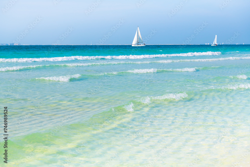 Beautiful beach with white sand and turquoise water. Dubai, United Arab Emirates.