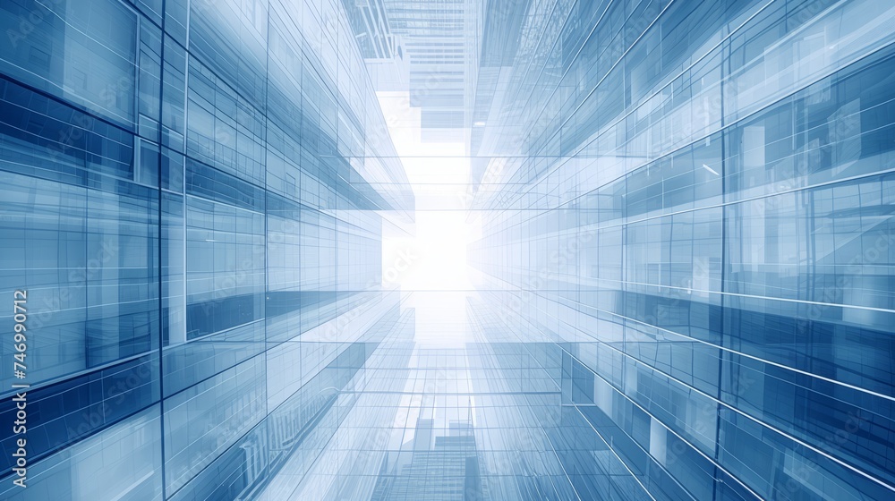 Modern office building with blue sky, and glass facades. Economy, finances, business activity concept, Bottom-up view, blurred image Modern office building with blue sky, and glass facades. Economy, finances, business activity concept, Bottom-up view, blurred image