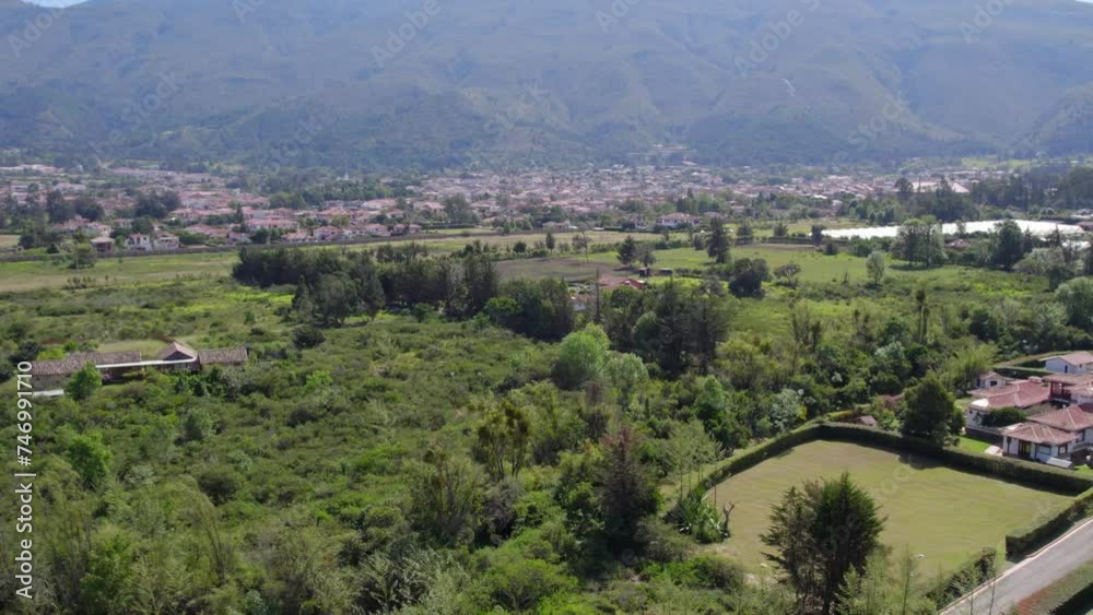 Cut to a sweeping aerial view: The drone gracefully glides over rows of meticulously preserved colonial houses, their terracotta roofs and whitewashed facades. Roll left with right yaw Cut to a sweeping aerial view: The drone gracefully glides over rows of meticulously preserved colonial houses, their terracotta roofs and whitewashed facades. Roll left with right yaw