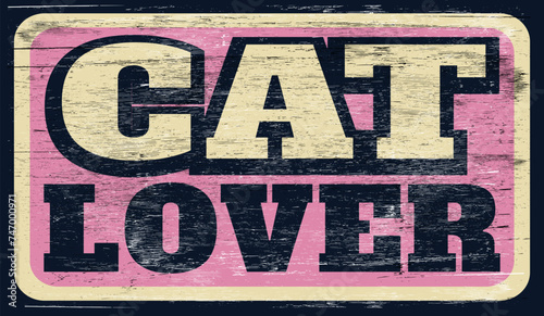 Aged and worn cat lover sign on wood